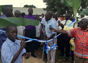 P-5 Student Okumu Luriu Translating During the Ribbon Cutting Ceremony for His Parents