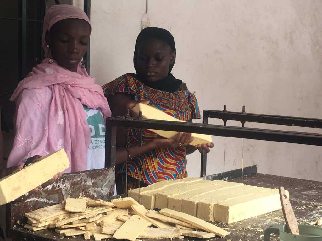 Beneficiaries cutting soap at the Suni Sanuman center 