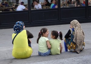 Sitting in Omonoia Square, a  common gathering spot for refugees