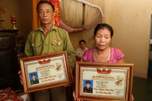 li thein and wife with placards