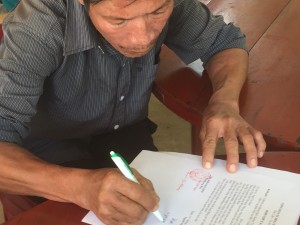 Mr. Hue signing the contract of sale.